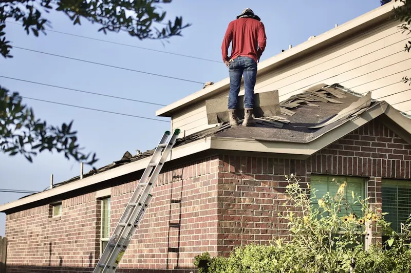 Professional roofer working on a residential roof in San Ramon